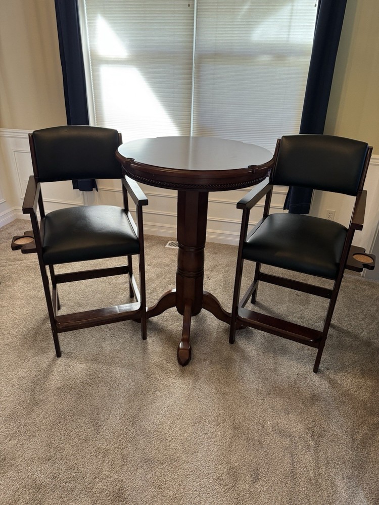 Pub table with kind of leather stools from Costco.