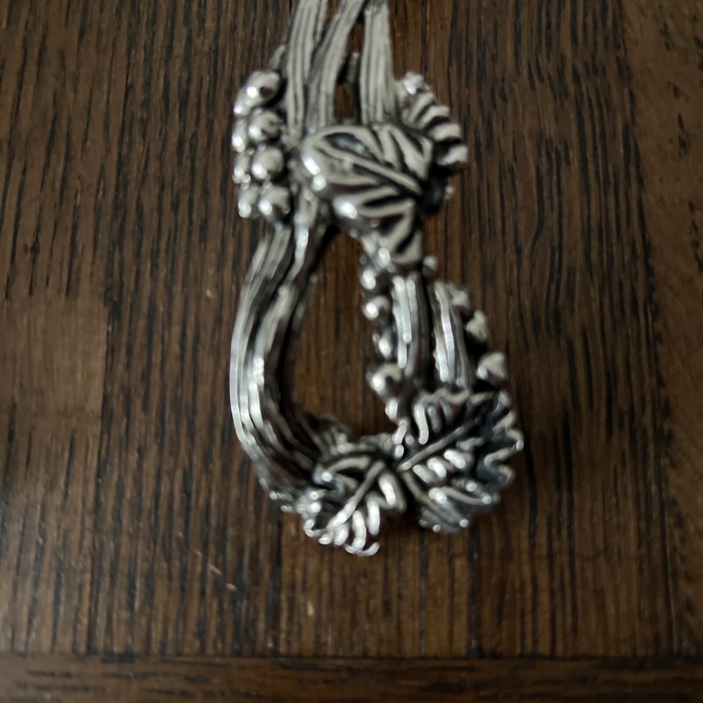 Two ornate serving utensils