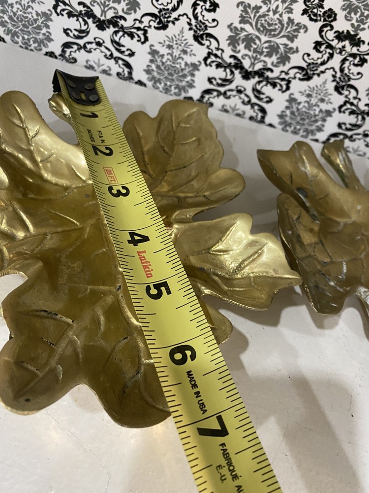 two beautiful solid brass leaf design wall decor. 7 inches tall.