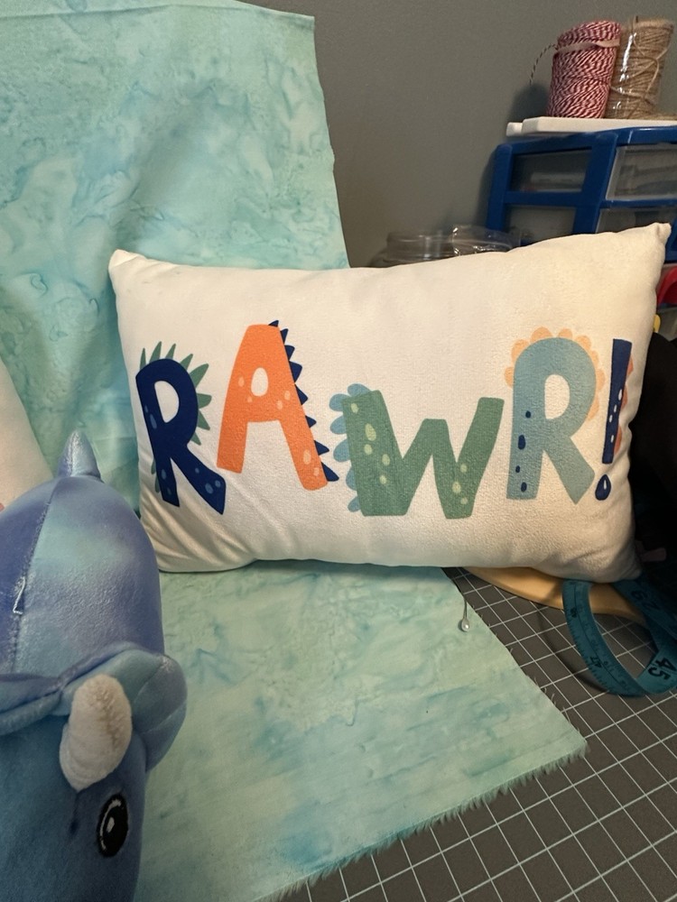 3 Crib Pillows And Dino stuffed toy