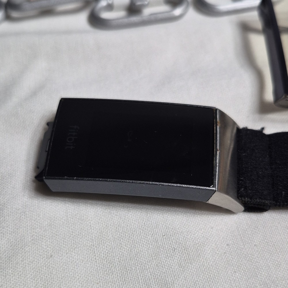 Fitbit Activity Tracker with Multiple Bands, Charging Cable, Protective Covers