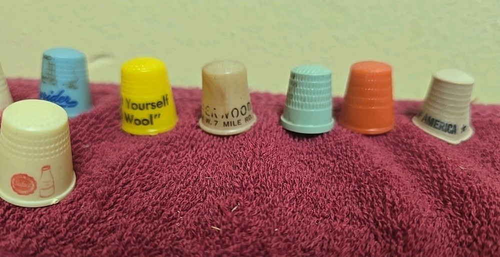 17 Plastic Thimbles 15 Have Advertising On Them