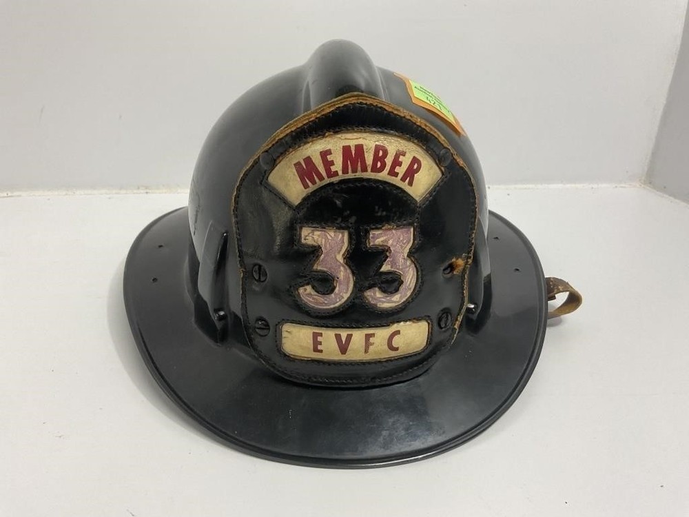 Black Firefighter Helmet front shield marked 'MEMBER 33 EVFC.
