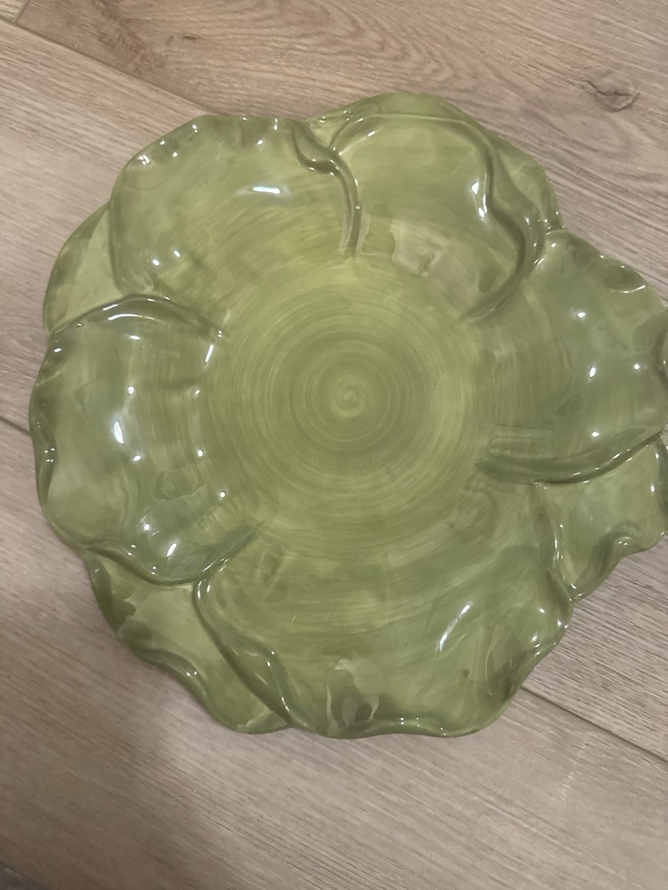 "Roscher Leaf Collection" and that it's microwave & dishwasher safe.