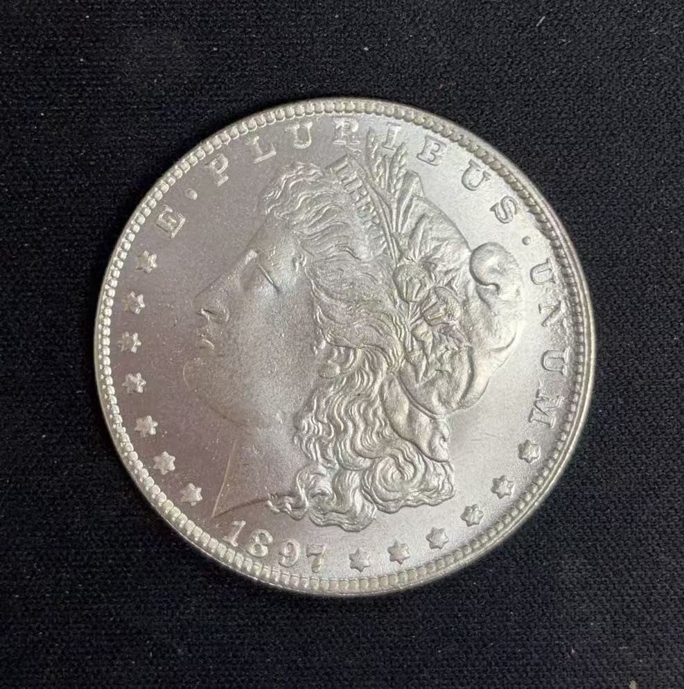 1897 Morgan silver dollar, copper coin