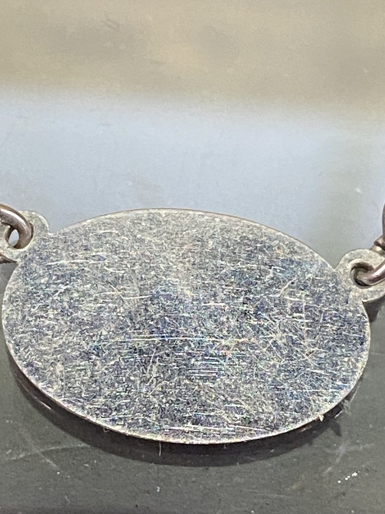Two Tie Clips, One Marked Anson