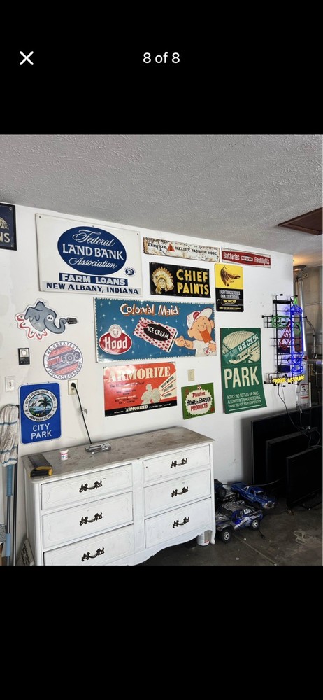 Feeds Cow Pass 500 Feet Embossed Tin Sign