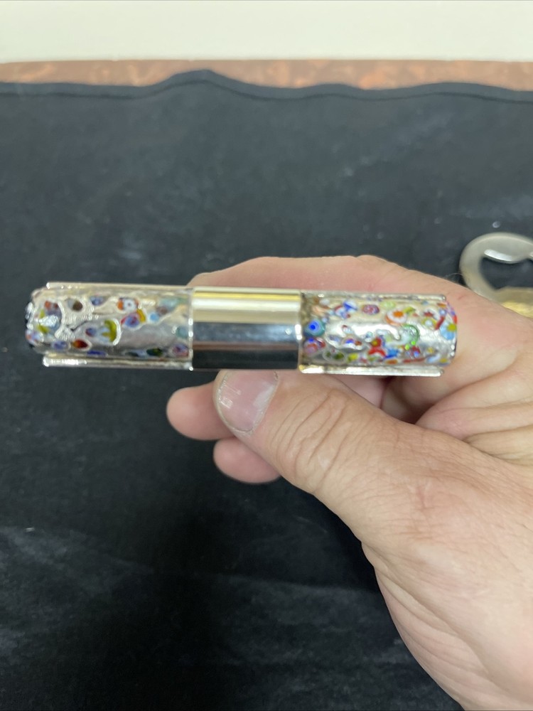 Silver corkscrew and bottle opener with blown glass insert