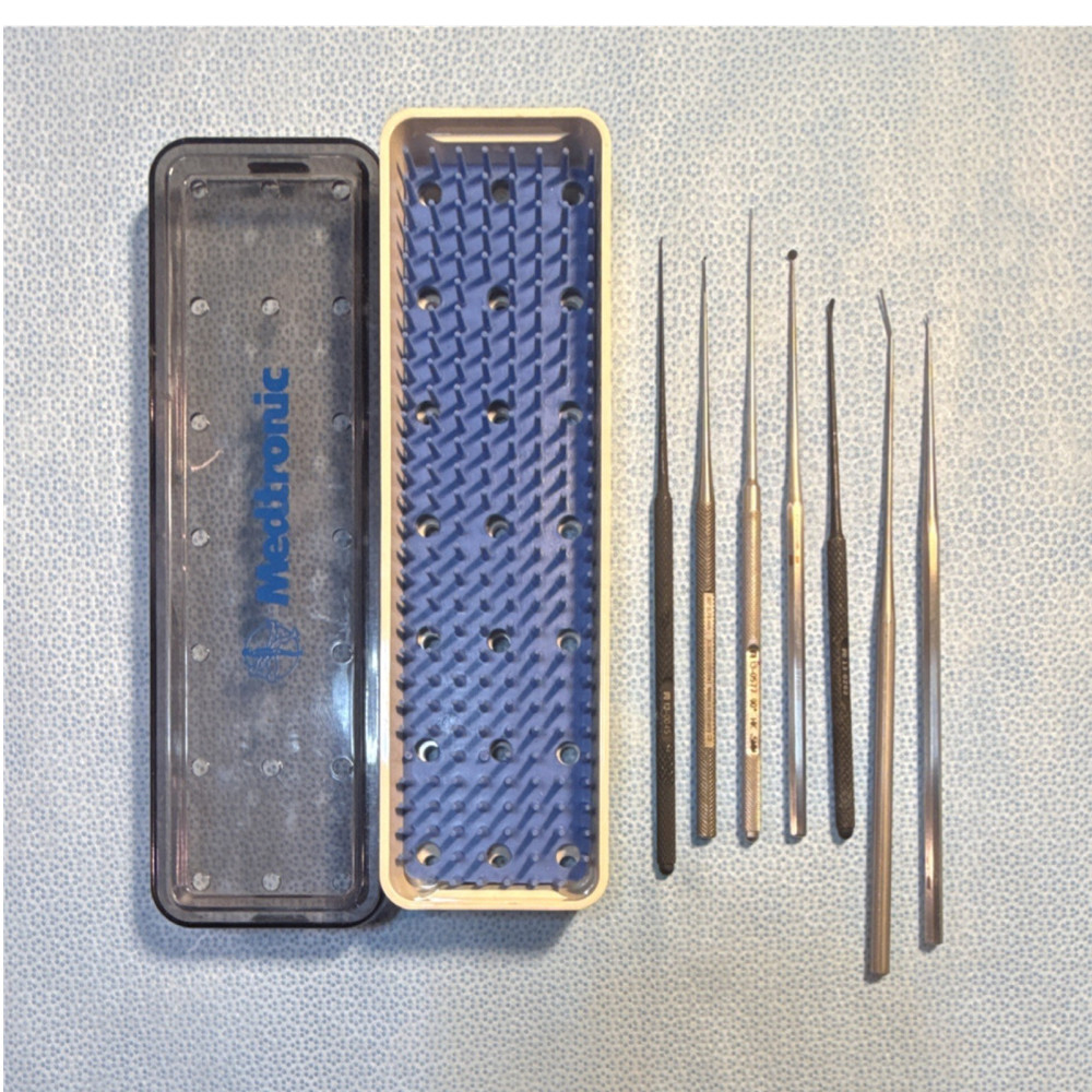 Seven piece otologic instrument pick set with case.