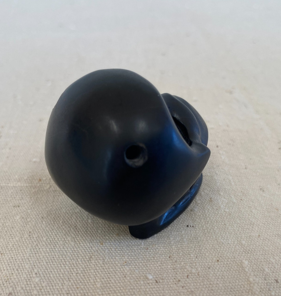 Stylized Carved Stone Skull Pendant