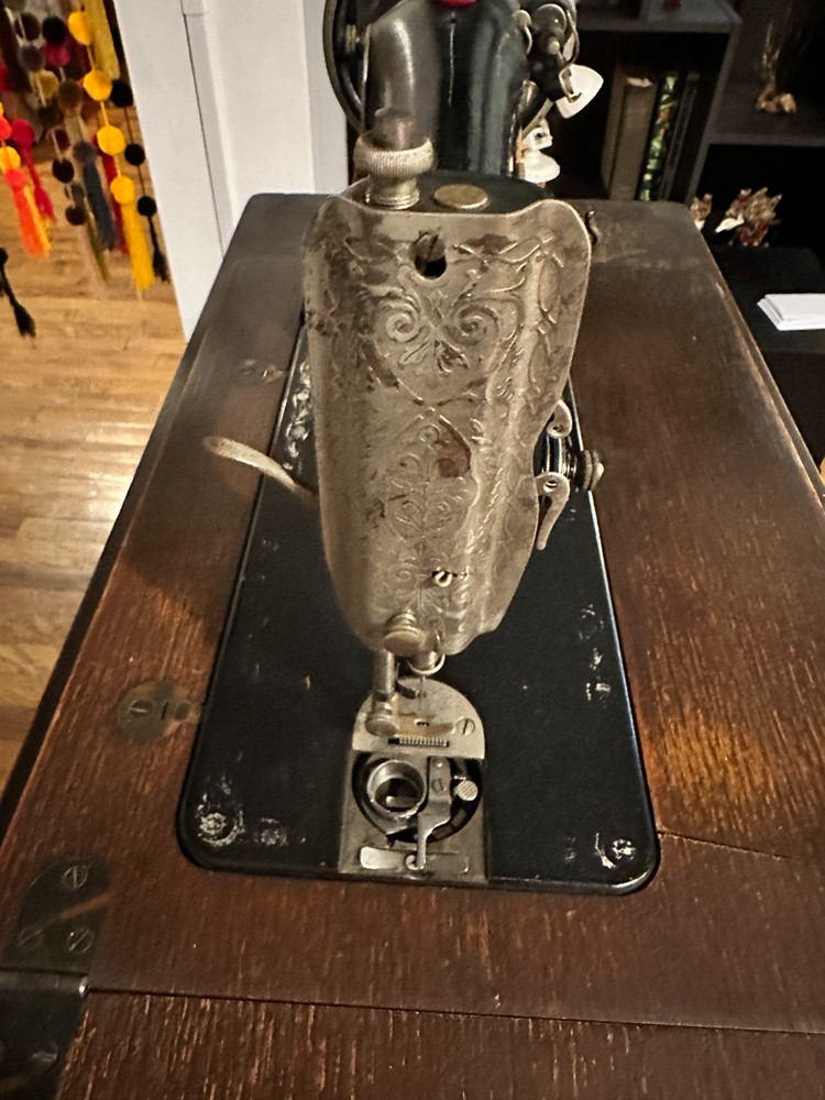 Singer Manufacturing Co. sewing machine with hideaway work station