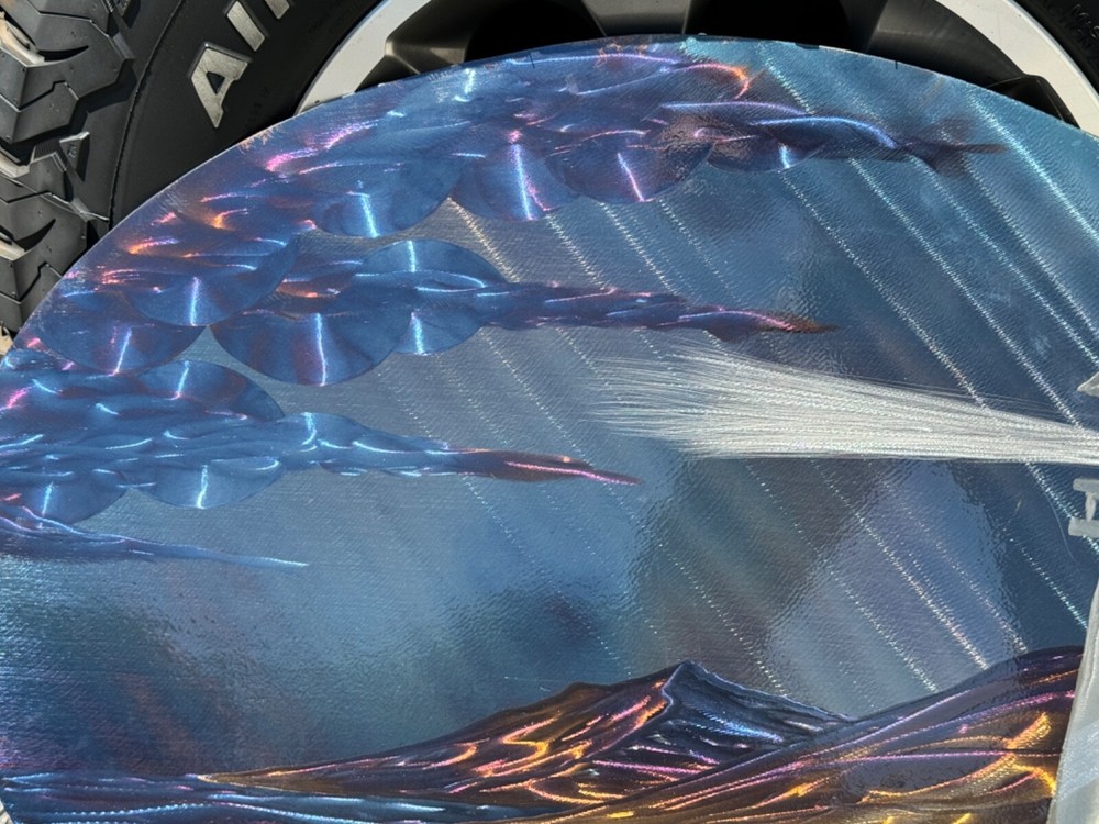 lasar etched artwork on metal lighthouse seascape
