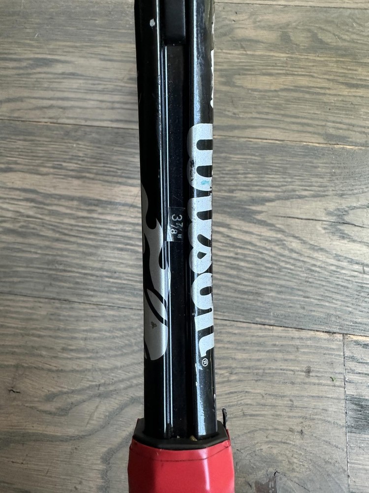Wilson Tennis Racquet with Red String Pattern
