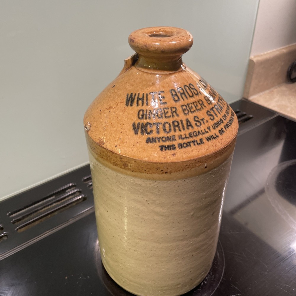 stoneware flagon. White Bros. Ginger Beer. Broken Handle