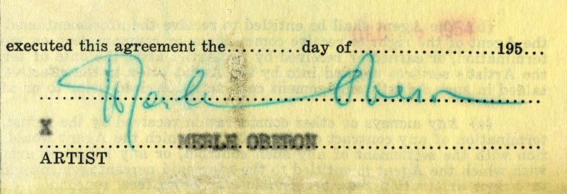 MERLE OBERON - PRINTED DOCUMENT FRAGMENT SIGNED IN INK