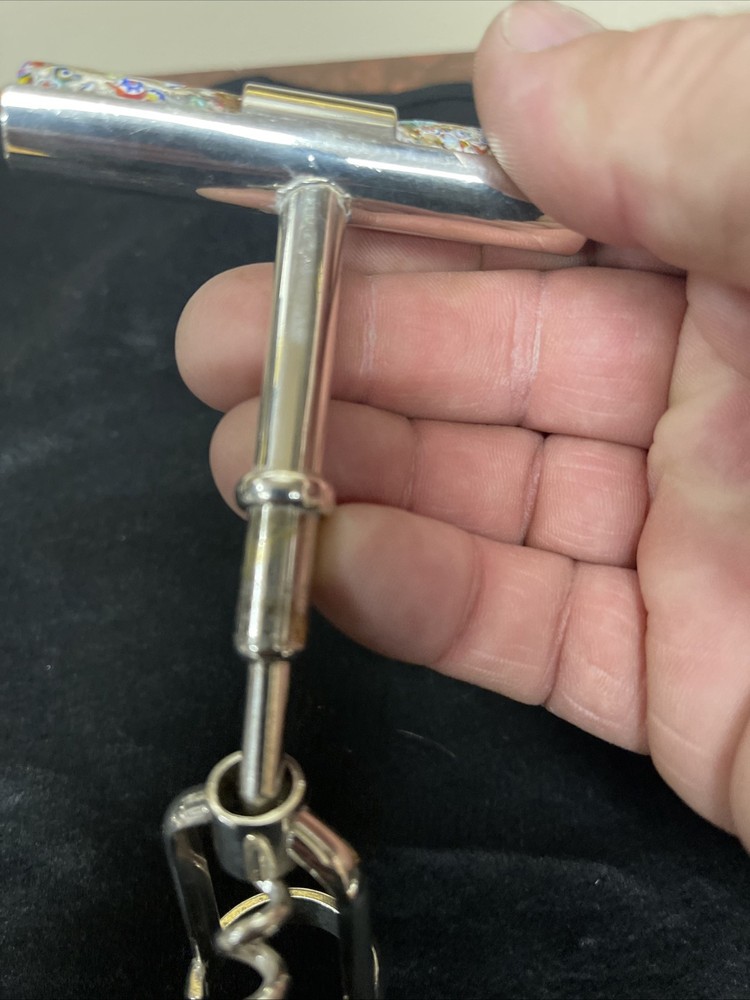 Silver corkscrew and bottle opener with blown glass insert