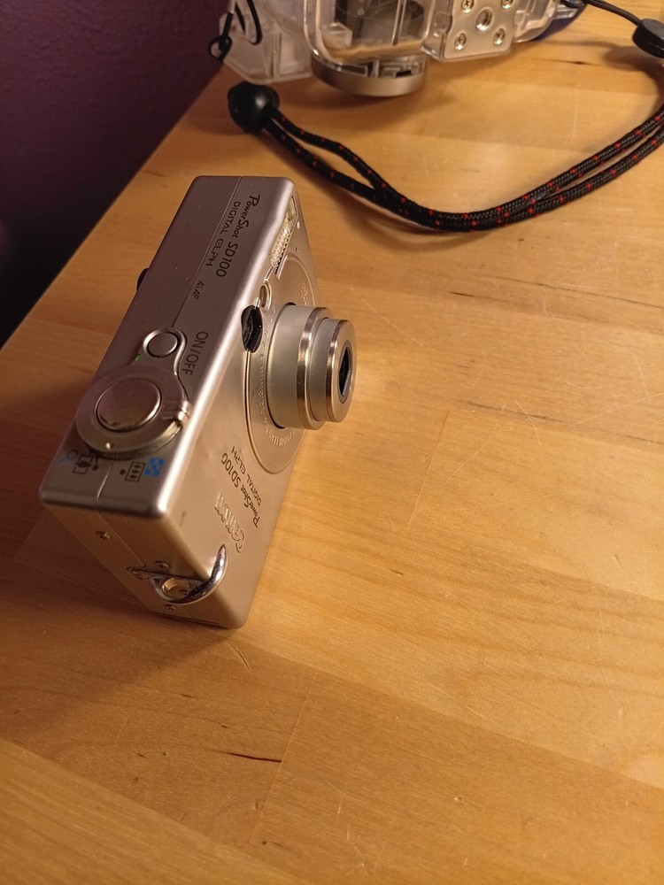 canon powershot sd100 and waterproof camera case housing with strap under water
