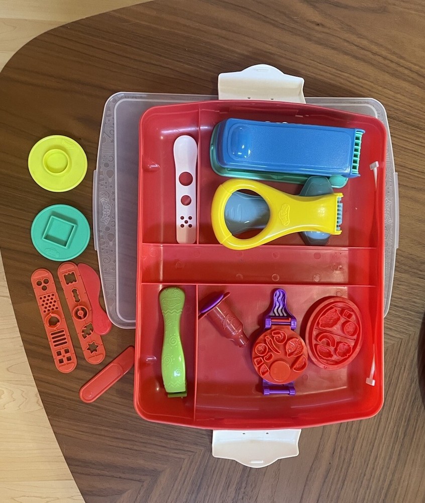 Random Play-Doh accessories including container