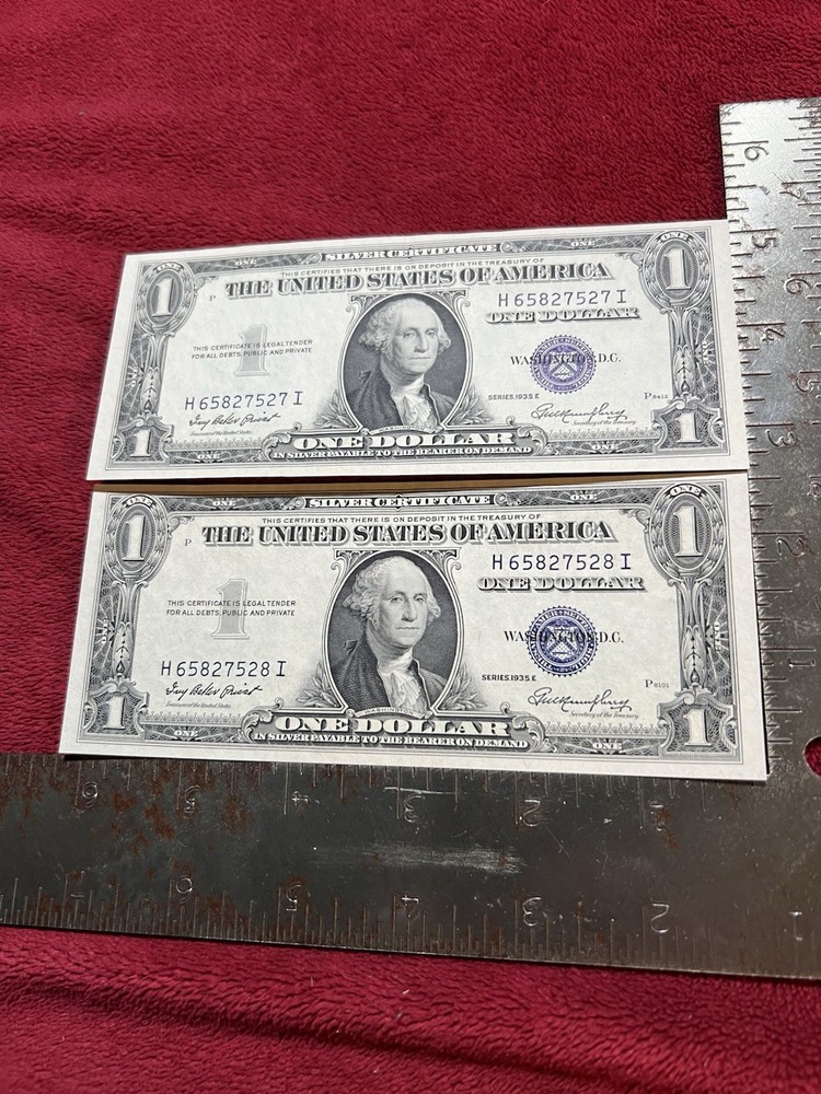 Consecutive Serial Number 1935E Blue Seal One Dollar Silver Certificates.