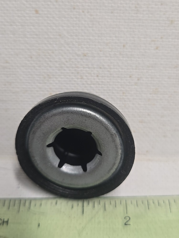 Cap Or Knob. Brown Plastic. 1.25" With .5" Opening