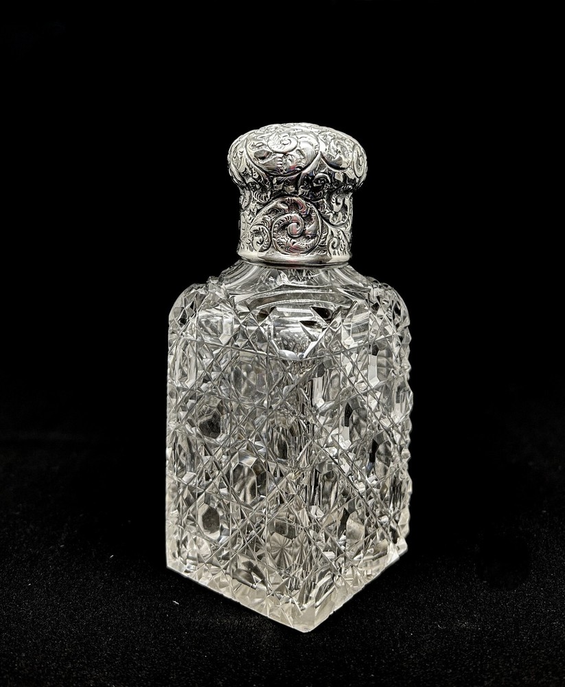 Edwardian sterling silver topped perfume bottle