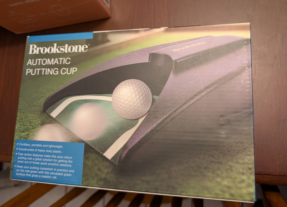 Brookstone Automatic Putting Cup Golf Putting Practice Aid Cordless Portable