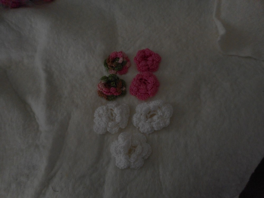 Seven crocheted flowers