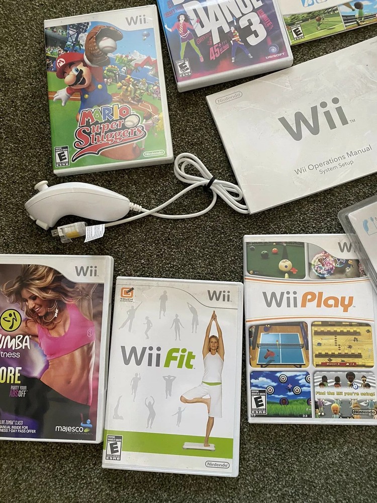 Nintendo Wii Bundle (includes Wii Fit And Other Games And Accessories)