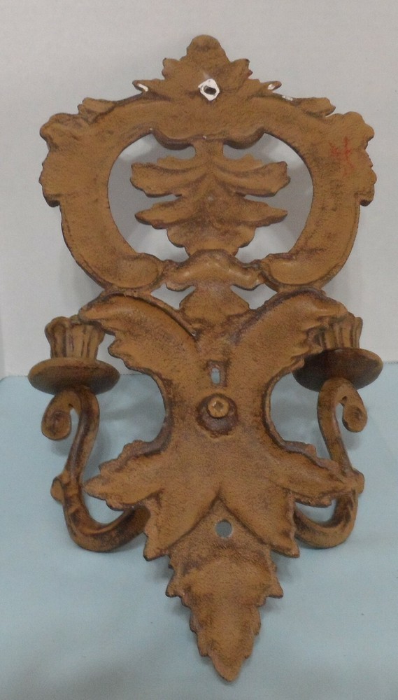 Ornate metal double head candle wall sconce