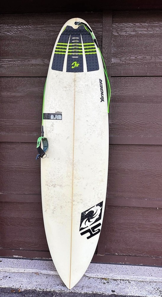 YANCER Surfboard and a cover