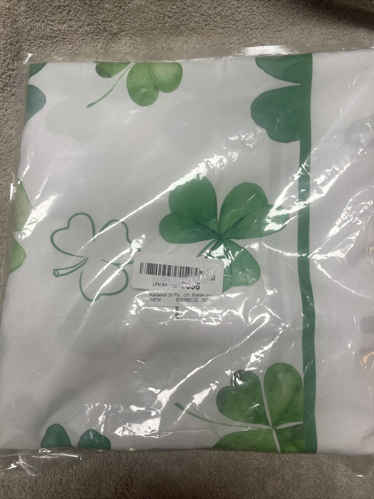 New In Pack St. Patrick Shamrock Table Cloth Measures 60” By 84”