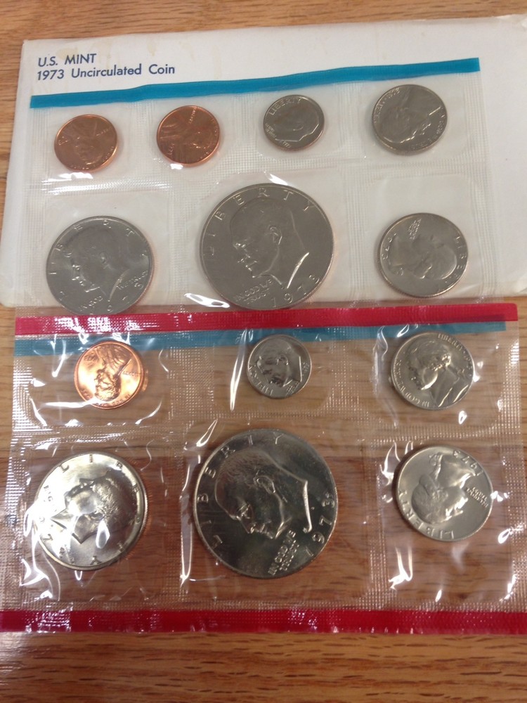 1973 and 1987 Mint Sets Includes 1973 Ike Dollars And 1987 Half Dollars