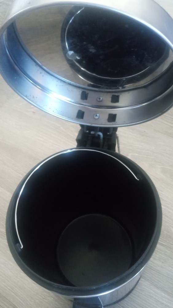 Small gray trash can
