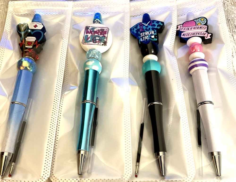 4 miscellaneous beaded pens with 1 ink refill each