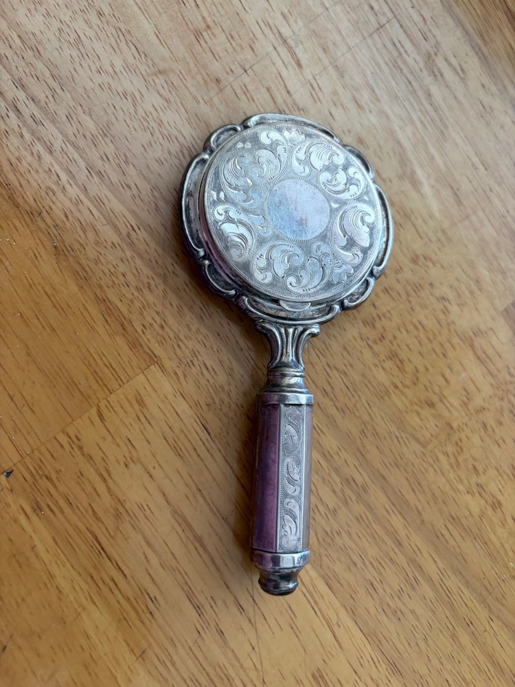 silver hand held mirror compact