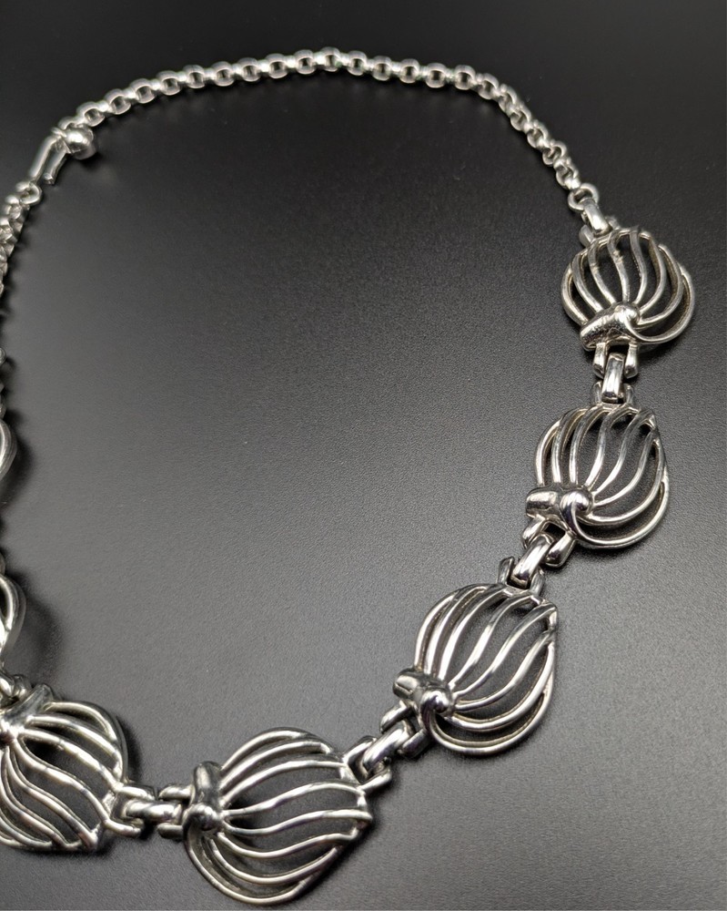 Silver-Toned Bracelet and Necklace Set Featuring Abstract Leaf Patterns