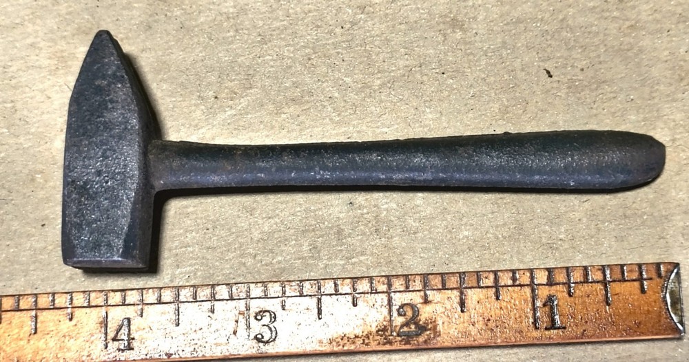 Vintage miniature anvil with hammer
