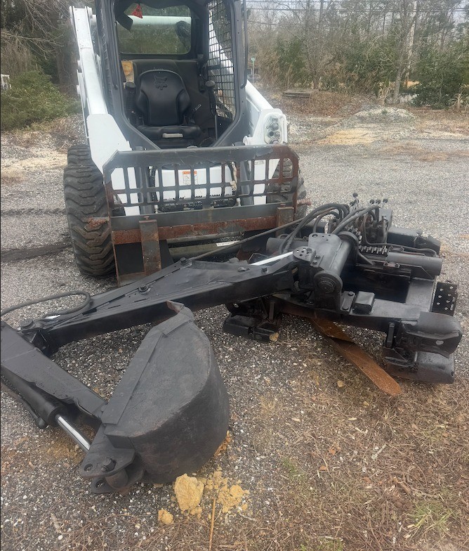 Heavy-duty white backhoe-used good shape