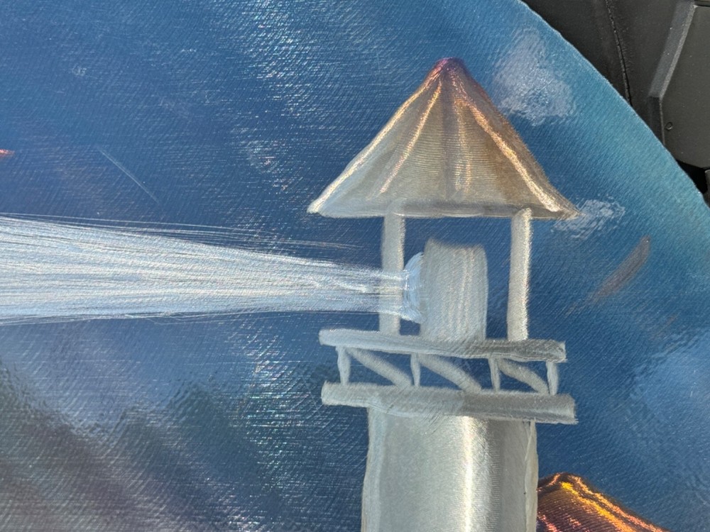 lasar etched artwork on metal lighthouse seascape