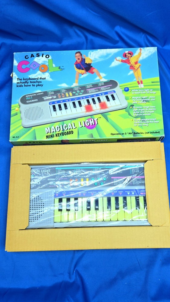 Casio ML-1 Magical Light Vintage Mini Light Up Teaching Keyboard Synthesizer