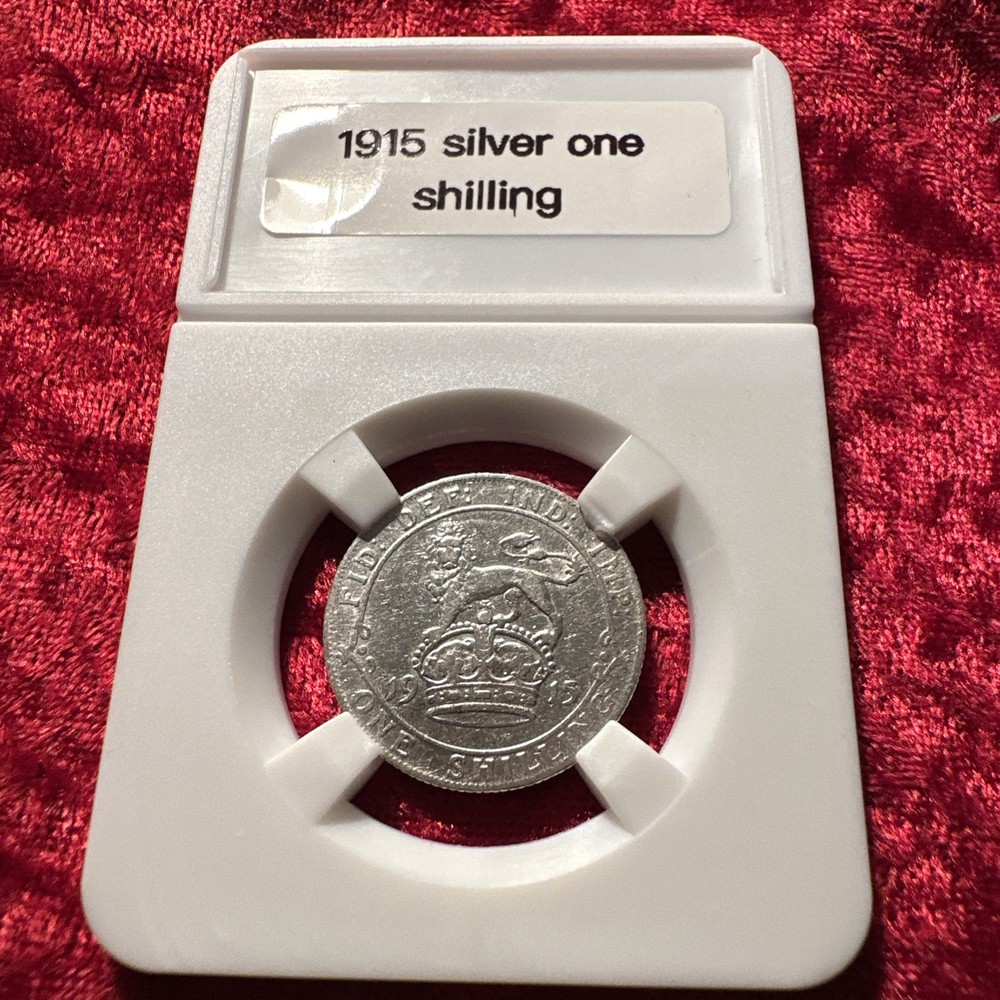 1915 silver  one shilling very nice condition slabbed ￼