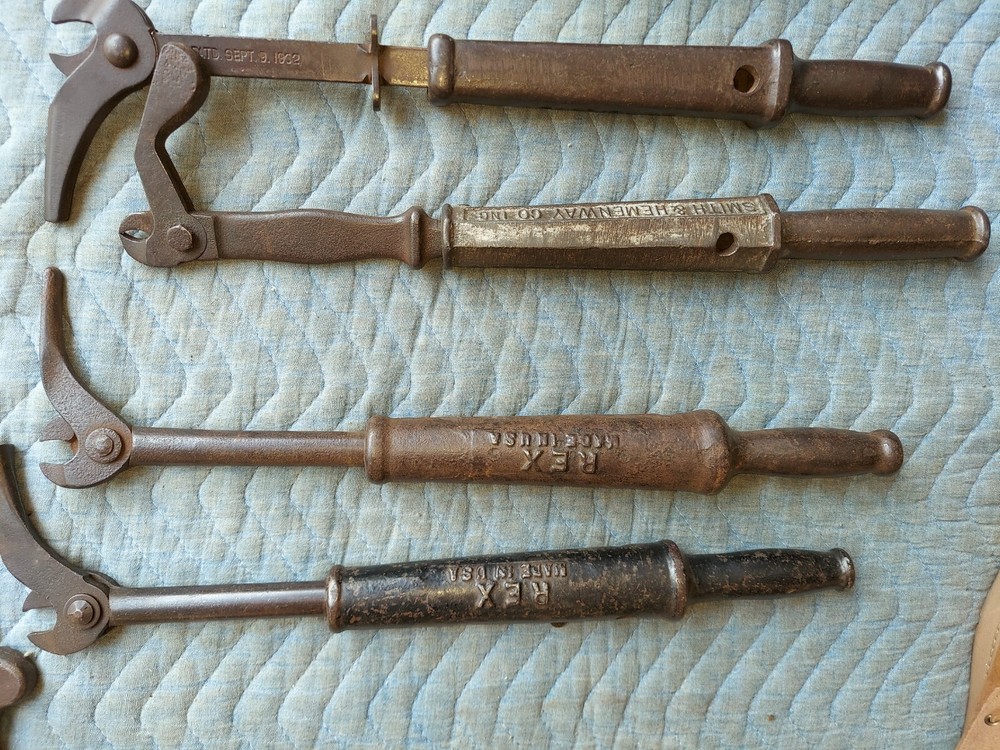 Collection of 8 different antique nail pullers