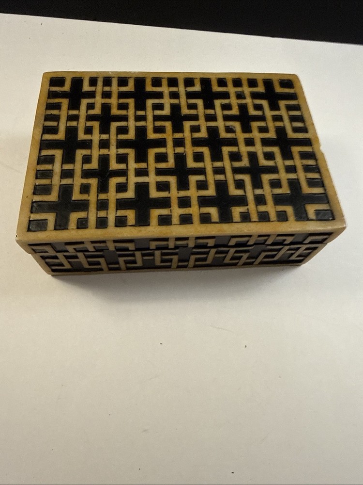 A decorative box with geometric inlay pattern, sold by Sears.