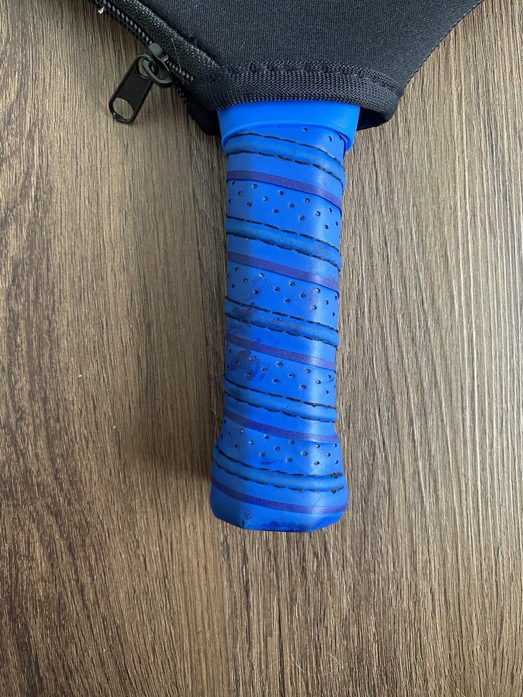 Play. Blue Pickleball Paddle Checkered Pattern Has Slight Wear On Handle