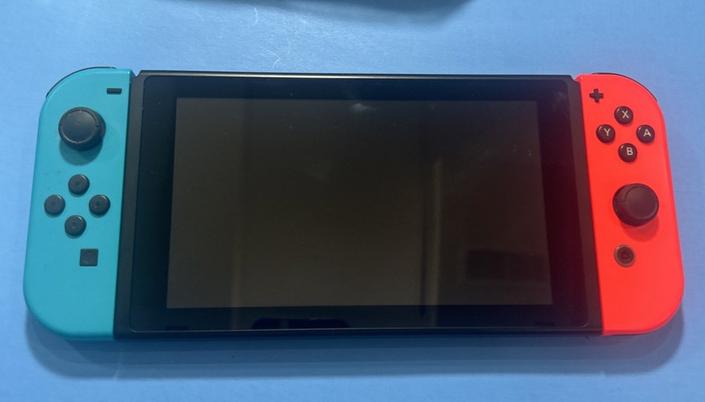 Nintendo Switch with Neon Blue and Neon Red Joy Con Bundle Complete