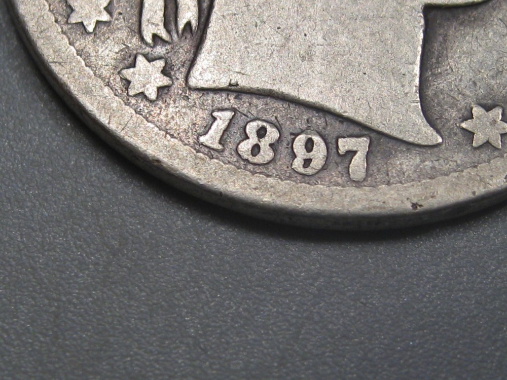 Better-date 1897-s Silver BARBER Half Dollar.