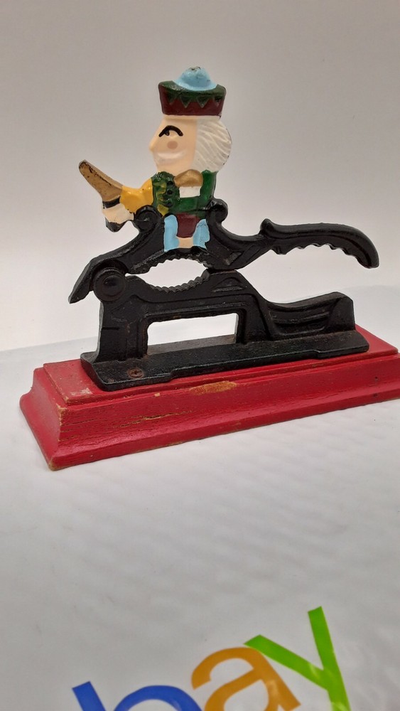 Vintage Nutcracker Cast Iron Red Wooden Base 7 1/2"