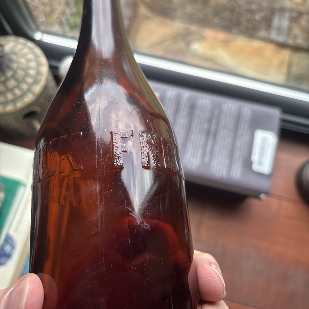 Stains Run From 101 Amber Embossed Bottle