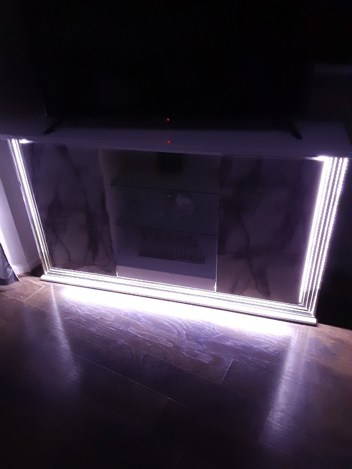 Marble Dining Table with 6 Gray Chairs and Beautiful Buffer with LED lights.