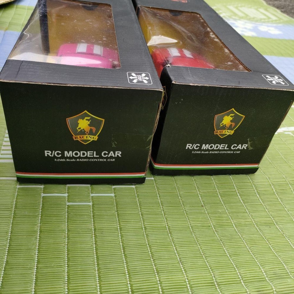 Two plastic radio-controlled cars